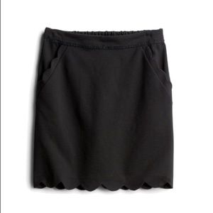 Black scalloped mini skirt